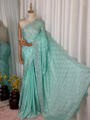 Picture of Mint green or light blue georgette saree featuring all-over heavy sequin embroidery.
