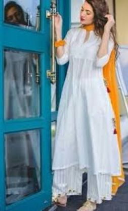 Picture of White, long-length A-line style kurta, paired with white palazzos and an orange dupatta.